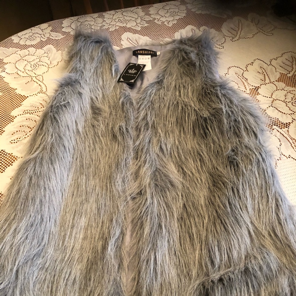 Brand new gray furry vest with tags still on